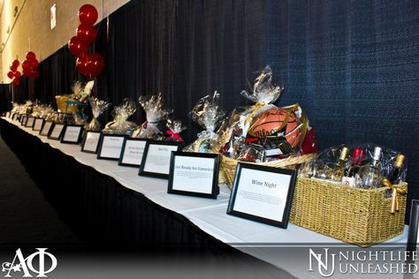 Nice basket table. Concise. Could use a pop of interest but like how easy to see descriptions and not cluttered.  Gamma Phi Auction Table. Love the frames to display the item descriptions. Fundraising Table Decorating Ideas, Auction Table Display Ideas, Fundraiser Table Ideas, Silent Auction Table Display, Silent Auction Set Up Display, Raffle Display Ideas, Silent Auction Set Up, Raffle Table Ideas, Silent Auction Display Ideas