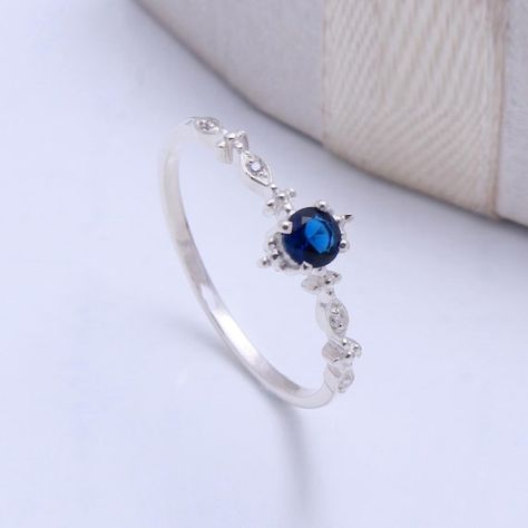 Check out this item in my Etsy shop https://www.etsy.com/in-en/listing/1057931393/cz-blue-sapphire-ring-dainty-sapphire Star Ruby Ring, Casual Rings, June Birthstone Ring, Pear Ring, Tiny Rings, London Blue Topaz Ring, Rainbow Moonstone Ring, Natural Blue Sapphire, Sapphire Necklace