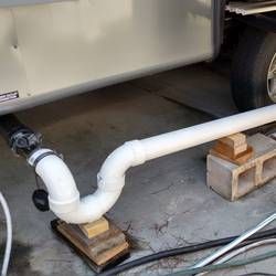 Rv Sewer Hookup At Home, Rv Shelter Ideas Diy, Rv Hookup At Home, Camper Revamp, Rv Restoration, Rv Plumbing, Rv Skirting, Rv Shelter, Camper Maintenance