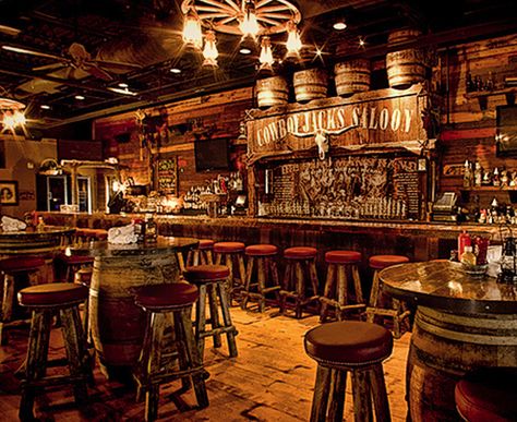 Interior Design Ideas Using Squirrel Cage Light Bulbs Country Bar Decor, Country Bar Design, Cowboy Restaurant Design, Country Bar Ideas, Cowboy Interior Design, Cowboy Restaurant, Rustic Bar Decor, Barrel Tables, Cowboy Bar