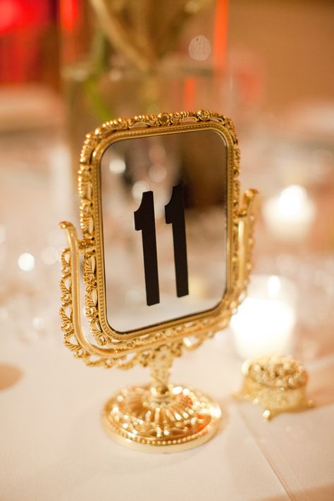 Table Numbers ~ simple & elegant. via http://StyleMePretty.com/2012/04/19/miami-wedding-at-coral-gables-country-club-by-kt-merry-photography/ Photography by ktmerry.com Creative Wedding Table Numbers, Old Hollywood Wedding, Hollywood Wedding, Number 11, Old Hollywood Glam, Gold Frames, Jean Harlow, Ava Gardner, Sophisticated Bride