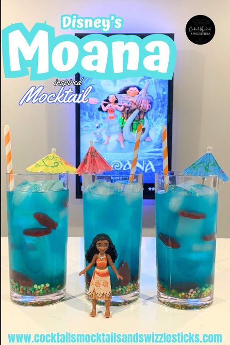 this image shows three blue drinks with nerds candy on the bottom, swedish fish thoughout, cocktail umbrellas and orange and white striped straws in front of a Moana movie poster with a Moana character in front of them. Disney Themed Drinks, Disney Movie Themed Dinner, Family Movie Night Themes, Disney Movie Night Menu, Disney Themed Movie Night, Disney Movie Night Food, Girls Night Drinks, Disney Themed Food, Disney Movie Night Dinner