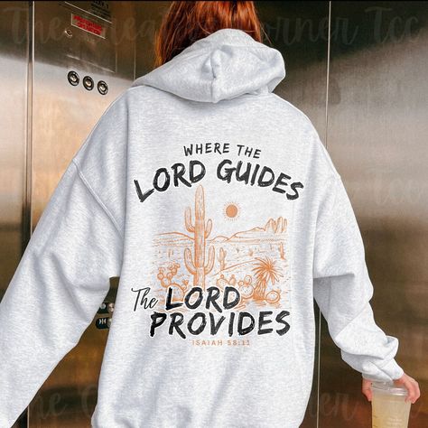 "Introducing our unisex \"Where The Lord Guides The Lord Provides\" Bible Verse Christian Hoodie, a stylish and meaningful addition to your wardrobe. Crafted with comfort in mind, this hoodie is perfect for the modern Christian who seeks both fashion and faith.  This unisex heavy blend hooded sweatshirt is pure relaxation. It is made of a thick blend of cotton and polyester, it feels plush, soft, cozy, and warm, a perfect choice for any cold day or cool evening. In the front, the spacious kangaroo pocket adds daily practicality and is especially useful to warm those cold hands. Choose size & color from the drop-down menu. For more Christian Merch ↓ https://www.etsy.com/ca/shop/TheCreativeCornerTCC --------------------------------------------------------------------------------------------- Jesus Merch, Christian Accessories, Jesus Clothes, Faith Apparel, Christian Shirts Designs, Christian Merch, Christian Hoodies, Faith Clothing, Christian Quotes God