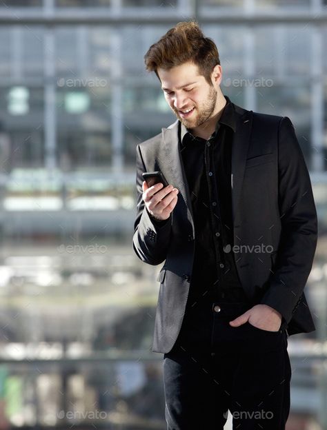 Handsome young man looking at mobile phone text message by mimagephotography. Portrait of a handsome young man looking at mobile phone text message#mobile, #phone, #man, #Handsome Phone Text Message, Men Fashion Photoshoot, Happy Guy, Best Mobile Phone, Business Portrait, Cool Poses, Suit Style, Guy Pictures, Hey Girl