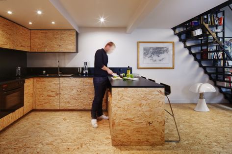 flca architecture renovates parisian apartment using OSB wood and steel Garage Kasten, Osb Furniture, Osb Wood, Attic Bedroom Small, Strand Board, Oriented Strand Board, Attic Renovation Ideas, Small Attic, Multifunctional Space