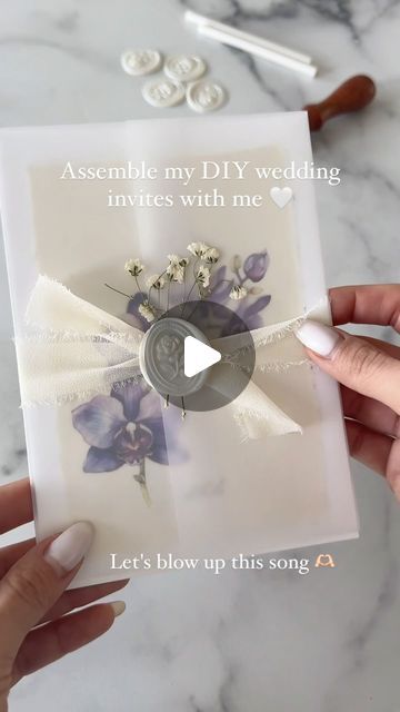 GL | 2024 bride 💍 on Instagram: "Assembling my wedding invites while listening to this song on repeat 🤍  #diyweddinginvitations #weddinginvitations #invitationsuite #canvawedding #commissionsearned" Tied Wedding Invitations, Songs For Wedding Invitation, How To Assemble Wedding Invitations, Diy Wedding Invitation Suite, Wedding Invitation Assembly, Wedding Invitation Songs, Wedding Invitation Suite Assembly, Wedding Invitations 2024, Song On Repeat