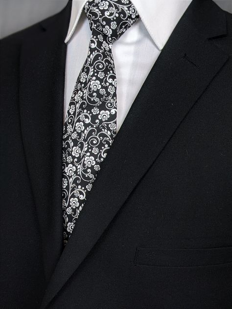 Elegant necktie for the big day. Makes the perfect gift for the father of the bride. Features a black background with white floral pattern. #White #Black #Necktie #Floral #Flower #Wedding Floral Wedding Tie, Winter Bridesmaid, Winter Bridesmaids, Winter Bridesmaid Dresses, Make A Tie, Floral Necktie, Flower Tie, Wedding Tie, Black And White Theme