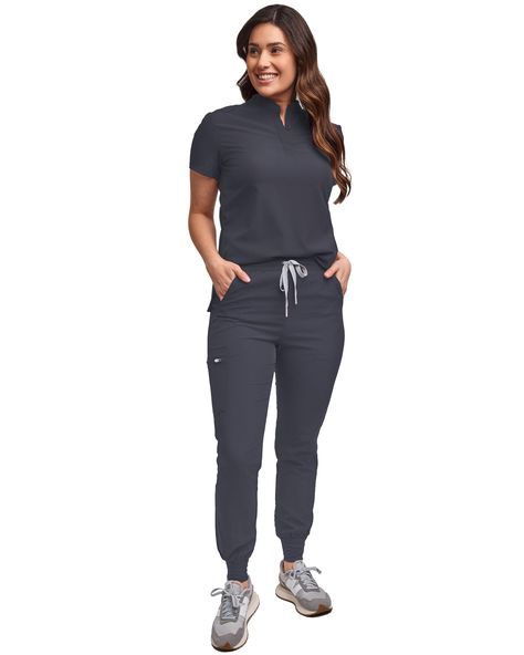 PRICES MAY VARY. SLIM FIT JOGGER: This scrub set is a must-have essential! The jogger pant comes with a modern slim fit, contrast drawstring, and an elastic waist band. Ideal for the medical field, the slim fit jogger features 4 roomy pockets to help keep your items secure while completing tasks throughout the day. Dress this jogger pant up or down, perfect for working out or lounging around on your days off. You'll love the versatility of this pant! Regular Inseam: 29" Center Back Length: 26.5" Grey Scrubs Outfit, Jogger Scrubs Outfit, Nurse Fits, Physical Therapist Outfit, Scrubs Uniform Cute, Scrubs Style, Scrub Outfits, Office Work Attire, Scrubs For Women