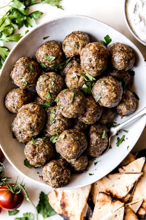 These tender Mediterranean Meatballs are served with our favorite simple tzatziki sauce and make for a delicious and unexpected weeknight dinner. Mediterranean Meatballs, Tzatziki Sauce, Greek Dishes, Dinner Healthy, Mediterranean Cuisine, Mediterranean Dishes, Minced Meat, Mediterranean Diet Recipes, Meatball Recipes