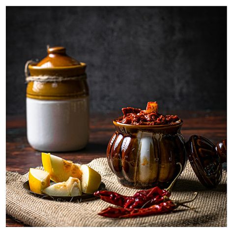 Indian pickle bowls are the melting pots of deliciousness, tradition and wellness! With a mouth-watering flavour & aroma around the house, Indian pickles have a home-calling touch of tradition. Usually, they are found shining bright in sunlight during summer, in every Indian household. PC: Macherla Rahul https://instagram.com/macherla_rahul?utm_medium=copy_link Pickle Photography, Pickle Platter, Indian Pickles, House Indian, Chicken Pickle, Food Shoot, Lime Pickles, Product Shoot, Shoot Ideas