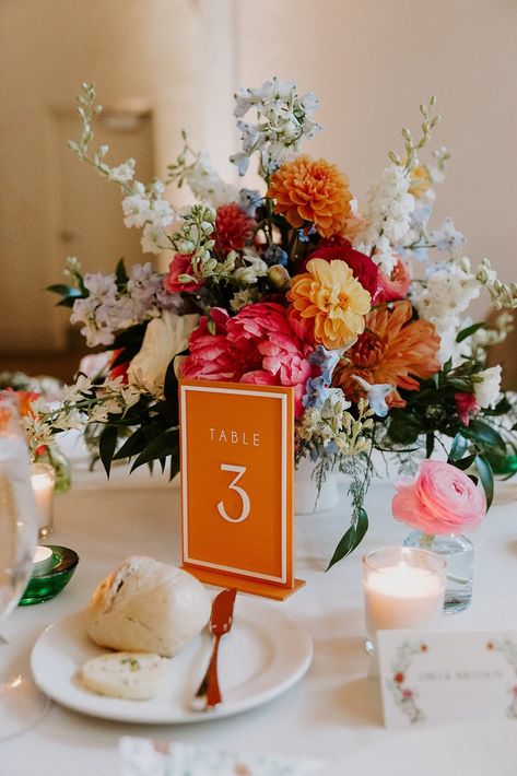 Wedding table numbers are a must have. Get these beauties in a large assortment of colors!  -- HOW TO ORDER -- *All lettering and numbers are default white except for white signs which will be black. Please message me for different color options* Select table numbers from drop down and if you would like the signs with a border. EXAMPLE: If you would like tables 1-15: select 1-5 and add to cart then go back to listing and select 6-10 and add to cart then go back and select 11-15 and add to cart T Floral Wedding Table Decor, Colorful Wedding Table, Table Decor Colorful, Elegant Mexican Wedding, Pink Table Numbers, Colored Table, Wildflower Wedding Theme, Floral Wedding Table, Multicolor Wedding