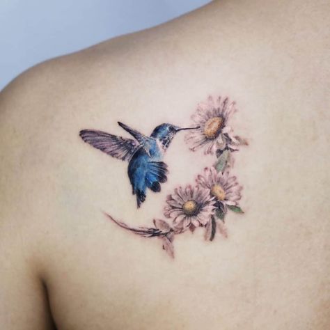 Hummingbird Tattoos: Meanings, Tattoo Designs & Ideas Hummingbird Tattoo Meaning, Hummingbird Flower Tattoos, Bird And Flower Tattoo, Small Hummingbird Tattoo, Flower Tattoo Meanings, Lavender Tattoo, Daisy Tattoo, Sunflower Tattoos, Hummingbird Tattoo