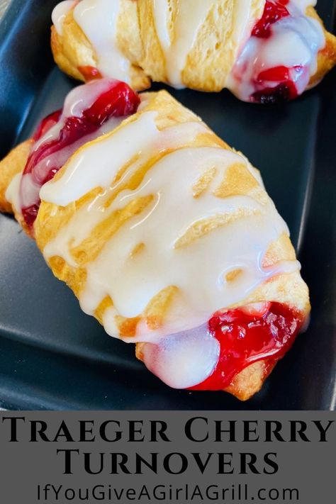 cherry turnover drizzled with icing Using Cherry Pie Filling, Cherry Turnovers, Pellet Smoker Recipes, Cream Cheese Crescent Rolls, Grilled Desserts, Traeger Recipes, Pellet Grill Recipes, Cherry Desserts, Cherry Pie Filling