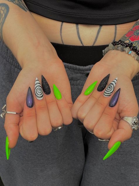 Modern Goth Nails, Gem Color Nails, Beetlejuice Nails Stiletto, Lock Shock Barrel Nails, Icp Juggalo Nail Ideas, Simple Spooky Nails Almond, Purple Green And Orange Nails, Goth Pride Nail, Beetlejuice Halloween Nails