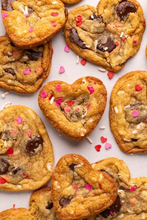 These easy Heart Shaped Chocolate Chip Cookies have 10 minute prep time. Just add red and pink sprinkles for a fun Valentine’s Day Cookie! Easy Heart Shaped Cookies, Heart Shape Chocolate Chip Cookies, Valentine’s Day Cookies, Heart Shaped Chocolate Chip Cookies, Shaped Chocolate Chip Cookies, Valentines Day Baking, Valentines Aesthetic, Confetti Cookies, Drop Cookie Recipes