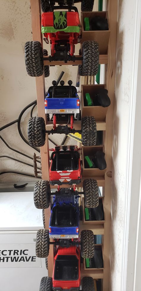 Remote Control Cars Storage, Big Toy Truck Storage, Rc Car Storage Ideas Diy, Toy Car Storage Ideas Organizing, Rc Storage Ideas, Rc Truck Storage Ideas, Power Wheels Storage, Monster Truck Storage Ideas, Remote Control Car Storage