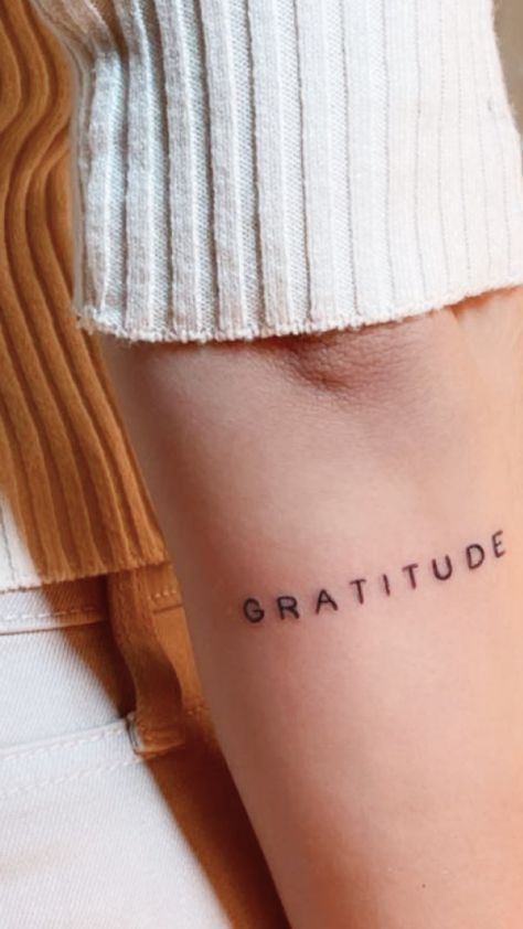 Subtle, small mantra word tattoo for women. Text Tattoo Arm, Simple Word Tattoos, Gratitude Tattoo, Ephemeral Tattoo, Font Tato, Wörter Tattoos, Tattoo Over Scar, Tattoo Design For Hand, Word Tattoo