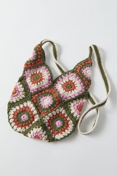 Casual crochet shoulder bag rendered in an open design with a long shoulder strap. Due to its handmade design, there may be slight variations from pictured. Content + Care. 100% Cotton Machine wash Imported Size. Length: 13” Width: 10” Height: 20” Strap drop: 20” Granny Square Crossbody Bag, Floral Crochet Pattern, Crochet Small Bag, Square Crossbody Bag, Urban Outfitters Bags, Urban Outfitters Bag, Granny Square Bag, Crochet Shoulder Bag, Crochet Handbags Patterns