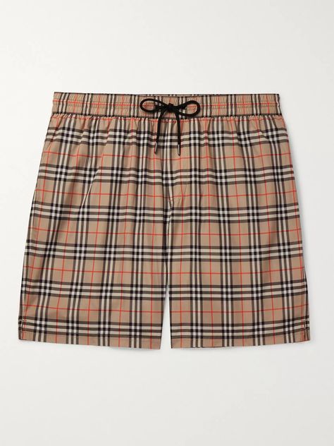 Burberry 's iconic check may be associated with rainy days and trench coats, but Mr Riccardo Tisci believes they'll look just as good on the beach, these swim shorts are a case in point. Patterned with the archival print, they have an elasticated drawstring waistband and longer length. Shown here with Burberry T-shirt, Valentino sandals, TOM FORD bracelet. Burberry Swim, Burberry Shorts, Valentino Sandals, Burberry T Shirt, Burberry Vintage, British Outfits, Burberry Brit, Pique Polo Shirt, Printed Swim