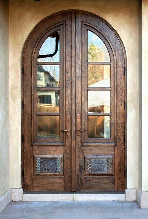 Antique carved panels adorn these arched French doors. The doors, made with salvaged lumber and antique woods, feature operable shutters. Arched Exterior Doors, Arched Entry Doors, Arched French Doors, Arched Interior, Arched Front Door, Custom Exterior Doors, Antique French Doors, French Doors Exterior, Wood Front Doors