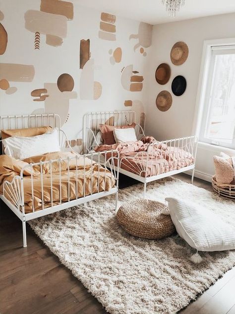 With its laid-back vibe, plentiful textures, emphasis on color, and layered patterns, the "boho" look is sure to please even the pickiest members of your family. Here are nine boho girls' rooms that any young lady would be happy to call their own. #hunkerhome #boho #girlsroom #bohobedroom #girlsbedroomideas Boho Girls Room, Shared Girls Room, Toddler Girl Room, Twin Beds, Shared Room, Toddler Rooms, Twins Room, غرفة ملابس, Nursery Baby Room