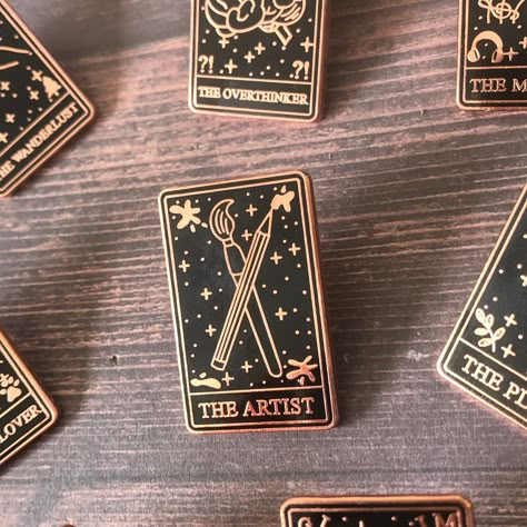 I see art in your future.. ✨   Are you an art lover? or do you know a artist? ) Than this pin is perfect as a way to show the world how much you or someone you know is art OBSESSED. Collect the full tarot card set! - Rose Gold Metal - Hard Enamel - Metal Clasp - Size: 31mm ------------------------------------------------------------- BUY ANY 3 PINS AND GET 10% OFF FREE SHIPPING (UK): OVER £15 | INTERNATIONAL: OVER £25 ------------------------------------------------------------ Please message me Tarot Card Set, Enamel Pin Collection, Stocking Filler Gifts, Enamel Badges, Pretty Pins, Pin Art, Rose Gold Metal, Metal Pins, Stocking Filler