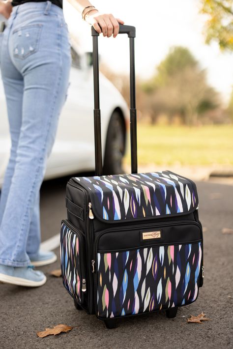 "Buy the Everything Mary Black Abstract Stripes Rolling Craft Bag at Michaels. com. This scrapbook rolling tote features a telescoping locking handle and a durable wheelset for secure craft storage. The Everything Mary Collapsible Rolling Craft Bag was made with crafters in mind. The Everything Mary Collapsible Rolling Craft Bag is the ultimate storage solution for any storage need you may have. This rolling organizer cart is constructed with durable polyester and features premium zippers, pipin Rolling Bags For Teachers, Rolling Laptop Bag, Organization Cart, Rolling Tote, Wheel Carrier, Rolling Bag, Teacher Tote, Coloring Supplies, Office Bag