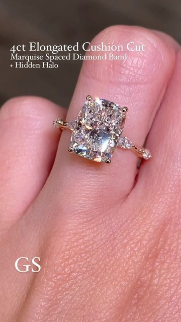 Golden String Inc on Instagram: "Finally posting this combo on the feed❤️‍🔥 This soft elongated cushion cut diamond was paired with our fav spaced marquise band and of course a hidden halo 😉   •4ct Elongated Cushion Cut on our Marquise Spaced Diamond Band + Hidden Halo 💎  The rings on our feed are custom therefore aren’t listed on our website! The best way to order is through DM, Email, or Phone. Available in both Natural and Lab Diamond  -Please Message All Price Inquiries✨  #radiantengagementring #radiantsolitairering #hiddenhaloengagementring #radianthiddenhalo  #cushioncutdiamond #cushioncutsolitaire #2caratdiamond #2carat #radiantcutdiamond #elongatedcushion #elongatedcushioncut #engagementring #cushioncutdiamond #yellowgoldradiant #labdiamondengagementring #labdiamond #radiantlabg Elongated Cushion Cut Engagement Ring Halo, Elongated Cushion Engagement Ring 5ct, Elongated Cushion With Hidden Halo, Elongated Cushion Engagement Ring Thick Gold Band, Spaced Diamond Band, Elongated Cushion Engagement Ring, Elongated Cushion Cut Engagement Ring, Marquise Band, Thick Gold Band