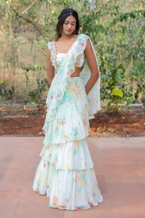 Trendy Traditional Outfits For Women, Saree With Frills, Recycling Saree Into Dress, Ruffle Half Saree Designs, White Saree For Haldi Ceremony, Ruffle Half Saree, Aza Fashion Saree, Blouse With Frills Sleeve, Floral Ruffle Saree