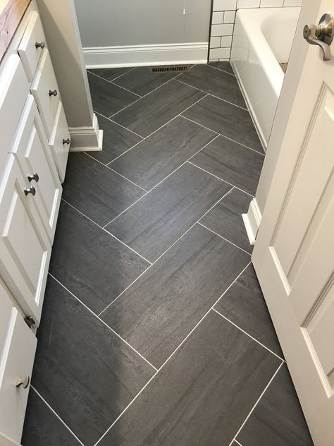 Grey Bathroom Flooring Ideas, Accent Tile Bathroom Floor, Farmhouse Bathroom Tile Floor Ideas, Floor Ideas For Bathroom, Bathroom Floor Tile Baseboard, Modern Tile For Bathroom Floor, Bathroom With Hardwood Floor Tile, Trending Bathroom Floor Tile 2023, Dark Shower Tile With Light Floor