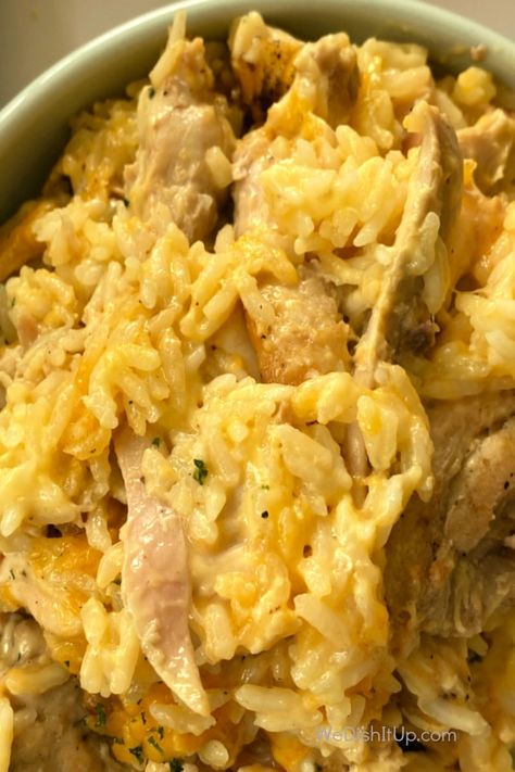 This Cheesy Chicken and Rice is fabulous. With chicken, white rice, cream of chicken soup, cheddar cheese and a few spices. Everything mixed in a baking dish and thrown in the oven. It is great for a weeknight dinner or a pot luck event. Cheesy Chicken And Rice Soup Recipes, Cheesy Chicken And Yellow Rice, Cream Of Chicken Soup Rice Recipes, Cheesy Chicken And Rice Oven, Chicken Rice With Cream Of Chicken Soup, Chicken And Long Grain Rice Recipes, Chicken And Cheddar Cheese Soup Recipes, Chicken And Rice Cream Of Chicken, Chicken Cheese And Rice Recipes