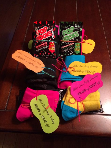 Dance party birthday favor. A pair of socks wrapped with pop rocks. Tag says "Allie's Dance Party Birthday ROCKED my SOCKS off!" Birthday Party Dance Theme, Dance Party Food Ideas, Dance Team Party Ideas, Sock Party, Neon Dance Party, Dance Party Theme, Dance Birthday Party, Neon Dance, Jive Dance