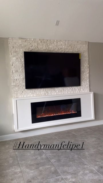 Handymanfelipe LLC on Instagram: "Floating Fireplace 🔥with Stone wall #livingroomdecor #livinroom #livingroomideas #livingroomdesign #livingroominspo #master #masterbedroom #madterbedroomdecor #floatingfireplace #accentwall #accentwalls #accentwallideas" Wall Mount Tv And Fireplace Ideas, Floating Fireplace Ideas With Tv, Wall Mounted Electric Fireplace Under Tv, Floating Fireplace Wall, Accent Wall With Fireplace And Tv, Fireplace With Stone Wall, Wall Mount Fireplace Ideas, Floating Fireplace Ideas, Fireplace On Wall