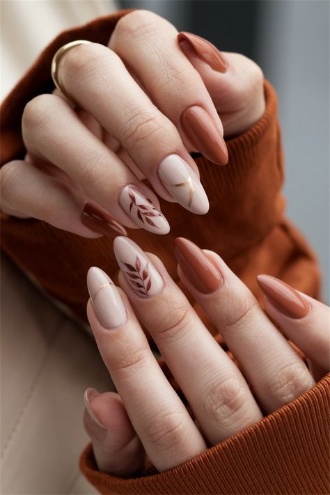 Embrace the essence of the season with these elegant autumn simple fall nail ideas that are effortlessly chic. Featuring muted tones of burnt orange and deep burgundy, this nail style encapsulates the warmth and beauty of autumn leaves. The addition of subtle gold accents brings just the right touch of glamour, making your nails the perfect accessory for any fall outfit. Dive into this seasonal delight and elevate your manicure game! Fall Drip Nails, Manicure Fall Nails, Leave Nails Fall, Simple Nail Ideas For Fall, Negative Space Nails Fall, Fall Nails Modern, Wedding Nails Alternative, Simple Fall Nail Designs Leaves, Fall Themed French Tip Nails