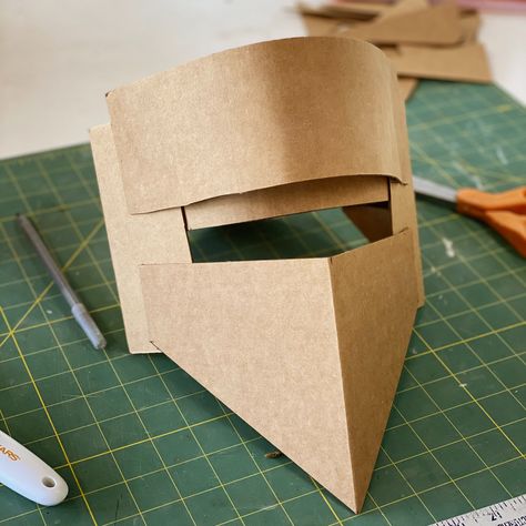 Cardboard Helmets — Hollowed Earth Pottery Cardboard Helmet Diy, Cardboard Helmet Template, Cardboard Knight Helmet, Diy Knight Helmet, Cardboard Halloween Costumes, Helmet Out Of Cardboard, Paper Helmet, Cardboard Armor, Cardboard Helmet