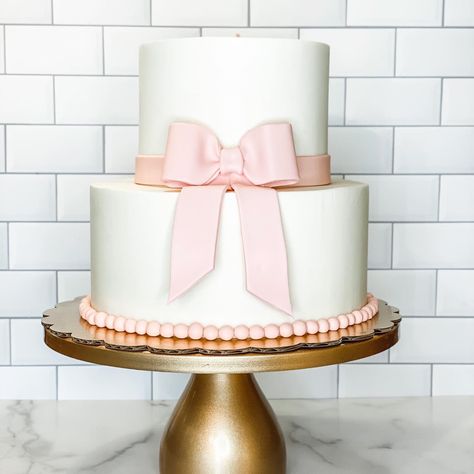 Pink And White 1st Birthday Theme, Cake With Bow On Top, Pink And White First Birthday Cake, Pretty In Pink 1st Birthday Party, Cake With Pink Bow, Bow First Birthday Cake, Pink Gingham Cake, Pink Bow Baby Shower Cake, Pink Bow 1st Birthday