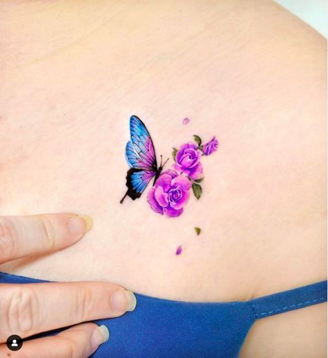 Small Purple Roses with Butterfly Tattoo Roses With Butterfly Tattoo, Tatoo Rose, Rose Represents, Rose And Butterfly Tattoo, Rose Tattoo Meaning, Rose Tattoo Ideas, Pink Rose Tattoos, Gem Tattoo, Tribute Tattoos