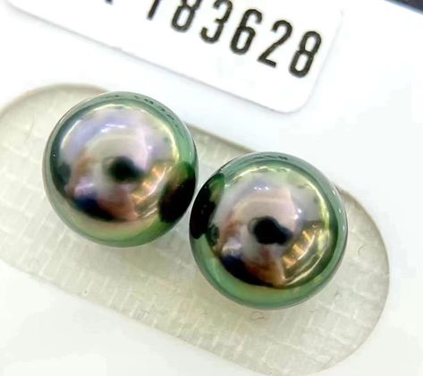 9mm Peacock Green Tahitian Pearl Pair SKU: 183628 Perfectly round with a glossy, smooth, and lustrous surface. Exceptionally vibrant and radiant. Comes with an authentic laboratory certificate. Dm for more details #tahitianpearls #peacockgreenpearl #blackpearl Peacock Green, Tahitian Pearls, Black Pearl, Green