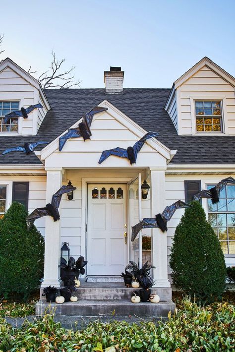 This year, skip the small pumpkin display and make a whole set of oversized bats to hang on the front of your house. These bats come together with a few simple materials (like hangers and trash bags) but they're spooky enough to display for a Halloween party, haunted house, or to welcome trick-or-treaters on Halloween night. #giantbatdiy #halloweendecorations #diyhalloweendecor #halloween #bhg Inexpensive Halloween Decorations, Porche Halloween, Outdoor Makeover, Haunted House Diy, Uhyggelig Halloween, Bat Decorations, Halloween Diy Outdoor, Halloween Bat Decorations, Pumpkin Display