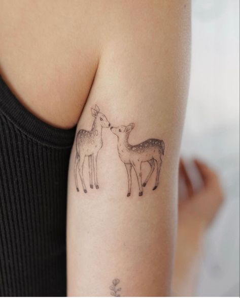 a sweet tattoo of two deer kissing on the back of the arm fine line style Buck And Fawn Tattoo, Fineline Deer Tattoo, Two Deer Tattoo, Sleeping Deer Tattoo, Deer Fine Line Tattoo, Doe And Fawn Tattoo, Dainty Fox Tattoo, Dainty Deer Tattoo, Fawn Tattoo Minimalist