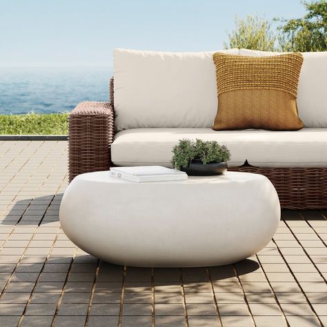 Transform your outdoor space into a haven for relaxing summer nights with these cozy patio furniture sets. From elegant dining sets to comfortable loungers, create the perfect setting for making memories with loved ones under the stars. Enjoy al fresco dining, cozy conversations, and peaceful moments in style with your own outdoor oasis. Explore our collection and elevate your evenings outdoors this summer. #patiofurniture #summernights #outdoorliving #cozyvibes Faux Cement Coffee Table, Outdoor Stone Coffee Table, White Outdoor Coffee Table, Entryway Courtyard, Cozy Patio Furniture, Modern Patio Decor, Cement Coffee Table, Balcony Coffee Table, Yard Seating