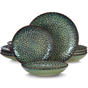 The Elama jade waves 16-piece dinnerware set in green brings a truly stunning accent to your tableware with its unique pattern and texture. The high gloss finish of this luxurious set will tantalize your sense of touch while the bold colors will entice your sense of sight. A textured pattern rim adorning the edges of the dinner and salad plates enhances the luxurious feel of these dinnerware pieces. The same rim runs along the top edge of the mugs to add a special touch complimenting the rest of Grey Dinnerware, Crockery Set, Restaurant Decoration, Plates And Bowls Set, Ceramic Dinnerware Set, Stoneware Dinnerware Sets, Solid Shapes, Stoneware Dinnerware, Grey Ceramics