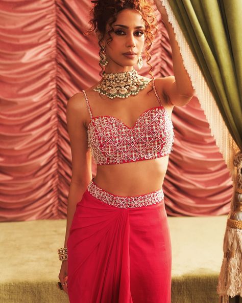 Step into the grandeur of Indian weddings with Seema Thukral’s latest collection, Haseena Dilruba. This collection is an ode to the rich heritage and vibrant traditions of India, beautifully infused into modern silhouettes. Whether you are the bride or a wedding guest, expect to be mesmerised by the timeless elegance and contemporary glamour in sarees, lehengas and more.. Find it on Fabilicious ✨ WhatsApp us on +91 99992 89222 for any queries 🌟Made to Measure 🌟Personal service with VC fo... Cape Set, Pink Cape, Rani Pink, Vacuum Storage, Indian Wedding Wear, Western Look, Draped Skirt, Sleeves Blouse, Embellished Blouse