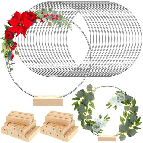 PRICES MAY VARY. What You Will Get: the package comes with 18 pieces of wreath macrame hoop rings and 18 pieces of wood place card holders, sufficient quantity and good collocation for you to decorate and replace, you can share them with your family Reliable Material: made of metal, these round centerpieces for tables have a smooth surface, safe for you to use, and the stand is made of quality wood, solid and trusted, sturdy and not easy to break, deform, rust or fade, can serve you for a long t Plastic Fadora Centerpieces, Table Leg Wreath Holder, Floral Hoop Table Centerpiece, Grave Wreath Holder, Table Centerpieces For 90 Birthday, Deco Anniv Cricut, Simple Paper Centerpieces, Bamboo Rings Centerpiece, Wreath Potted Plants Wedding Centerpiece