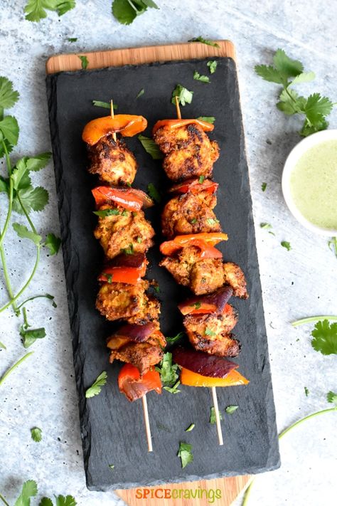 Chicken Tikka, is an extremely flavorful appetizer in north Indian cuisine! In this easy Airfryer or oven recipe, chicken chunks are marinated in yogurt and aromatic Indian spices, then grilled to a crisp brown texture! #spicecravings #chicken #indian #airfryer Chicken Tikka Kebab, Easy Airfryer, Chicken Tikka Recipe, Chicken Indian, Tikka Recipe, Oven Recipe, Indian Appetizers, Popular Appetizers, Chicken Chunks