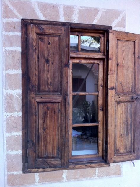 What if I put the shutters on the inside, with a sheer fabric or lace panel/valance between the shutter and the glass? Courtyard Mediterranean, Riad Courtyard, Moroccan Riad Courtyards, Mediterranean Exterior Design, Mediterranean Exterior Homes, Wood Shutters Exterior, Cabin Windows, Moroccan Riad, Rustic Shutters