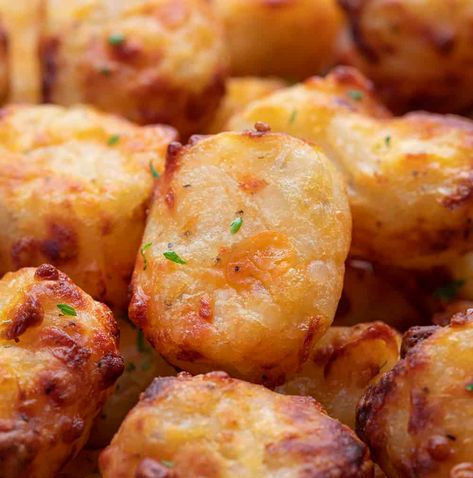 Air Fryer Cheesy Tater Tots are shredded potatoes mixed with cheese, formed into tots, and cooked in an air fryer for a crispy, cheesy appetizer. Tater Tots, How to Make Tater Tots, Cheesy Tatertots, Cheese Filled Tater Tots, Appetizer, Dinner, Recipes, Cheesy Tots, i am homesteader, iamhomesteader Cheesy Tots, Homemade Tater Tots, Cheesy Tater Tots, Appetizer Dinner, Baked Potato Chips, Potato Tots, Potato Appetizers, Cheesy Appetizer, Homemade Appetizer