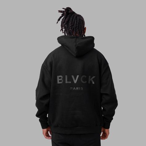 The 'Blvck x PSG' Hoodie is an eye-catching addition to your wardrobe, showcasing the PSG logo in white embroidery on the front, a striking black rubber print of the BLVCK logo at the back, and the PSG emblem on the sleeve. Crafted from luxuriously soft terry and fleece cotton, this hoodie is a necessity for everyday wear, perfect for the minimalist look. Oversized fit. Do not bleach. Wash with cold water. Iron on low heat. Hand wash with cold water. Minimalist Hoodie Design, Black Hoodie Outfit Casual, Psg Hoodie, Teddy Cartoon, Psg Logo, Black Hoodie Outfit, Blvck Paris, Hoodie Outfit Casual, Luxury Hoodie