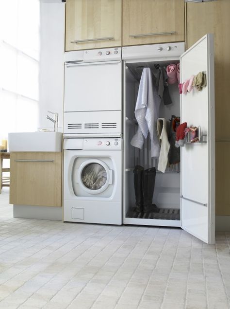 Drying Cabinet. It uses the heat radiated from the dryer to gently warm clothes that can not be put in the dryer. Drying Cupboard, Drying Cabinet, Laundry Room Appliances, Entryway Designs, Long Cabinet, Laundry Room Drying Rack, Ideas Entryway, Tiny Laundry Rooms, Hockey Gear