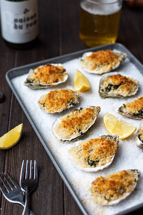 My baked oysters recipe is basically my own spin on Oysters Rockefeller. Pancetta, butter, shallot, garlic, panko crumbs, parmesan cheese, and baby spinach all come together to deliver a salty and slightly crispy oyster with a hint of smokey pancetta. It's an amazing combo of flavors you won't be able to deny. #bakedoysters #oystersrockefeller Charbroiled Oysters Recipe, Seafood Crepes, Baked Oyster Recipes, Oyster Bake, White Wine Pasta Sauce, Baked Oysters, Eating Oysters, Oysters Rockefeller, Grilled Oysters